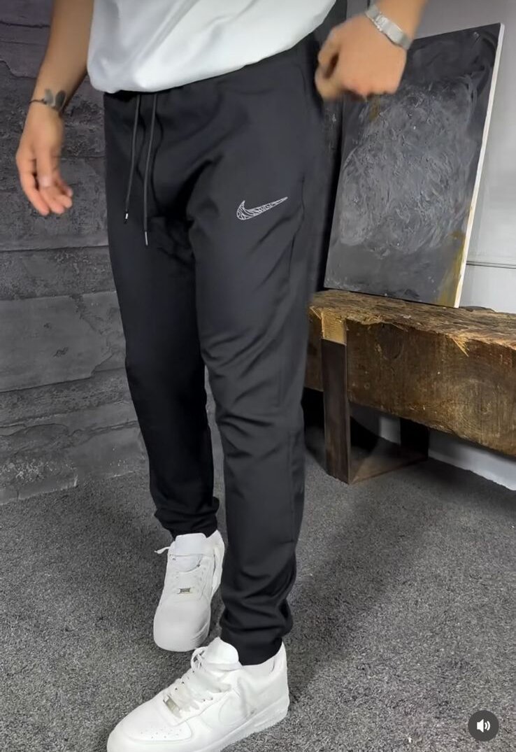 Pantallona Nike Dri-FIT Challenger Woven - E Zezë